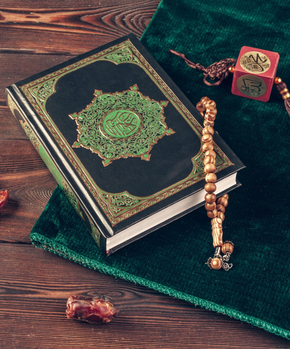 islamic holy book on wooden table. Close up.